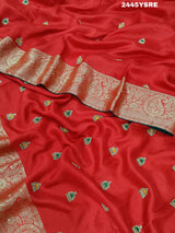 A red Banarasi silk saree with cutdana work and a golden border, 