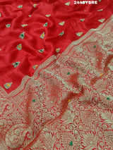 A red Banarasi silk saree with cutdana work and a golden border, 