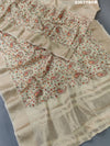 A cream-colored Kota Doriya saree with floral pattern