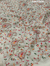 A cream-colored Kota Doriya saree with floral pattern