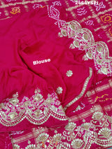 Apink saree with a bandhani pattern and gota patti work.