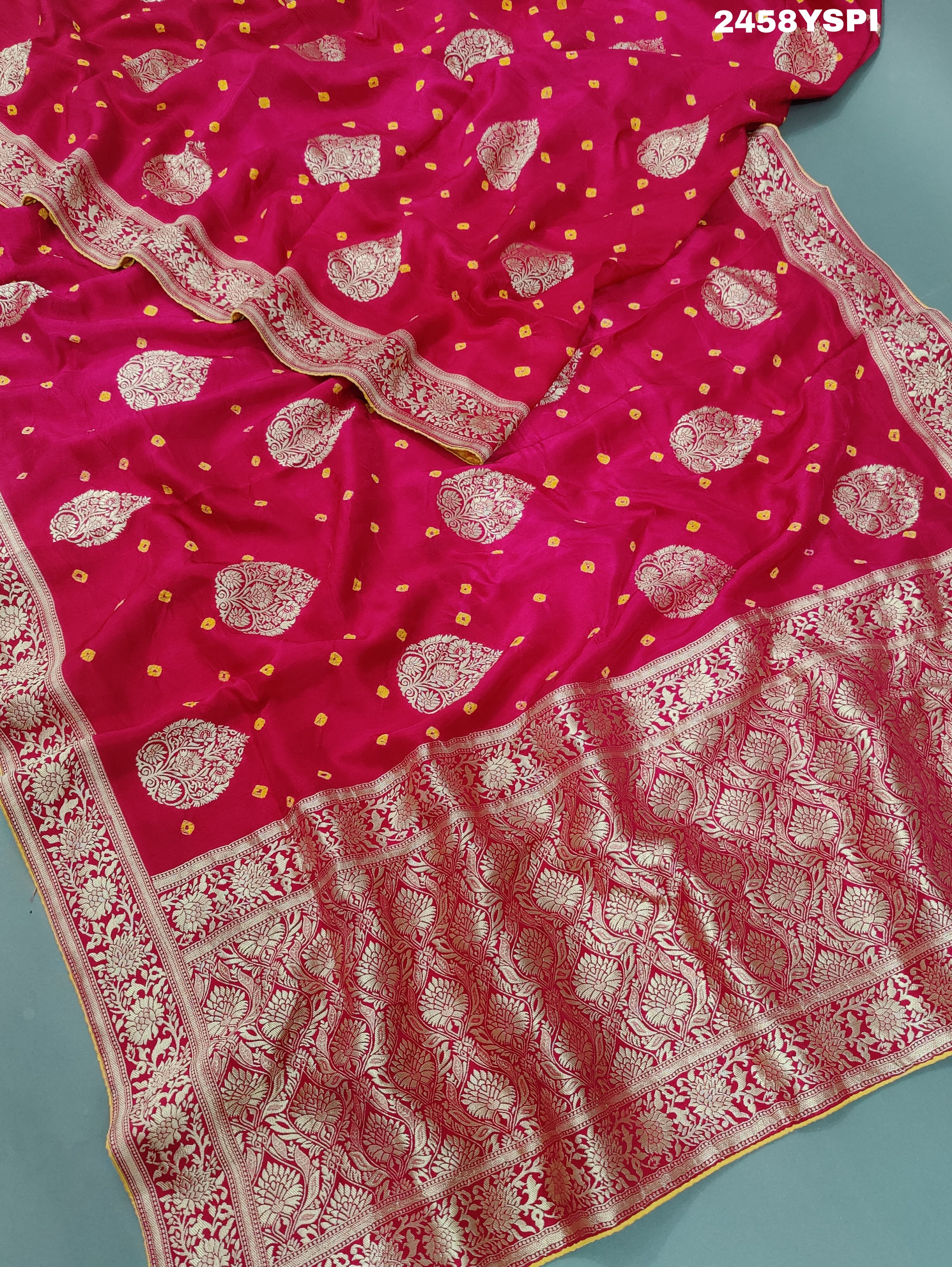 A pink Dola Silk Banarasi saree with Zari weaving work