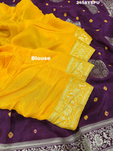 A purple Dola silk saree with detailed Zari weaving work and a Banarasi style pattern, including a wide border with similar ornate design.