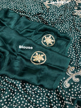 A green modal silk saree with bandhani style patterns and gotapatti work