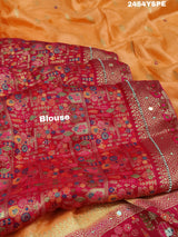 A Banarasi style saree with peach color and cutdana work, accompanied by a red and gold patterned border.