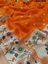 An orange Banarasi silk saree with floral printed style and zari weaving work