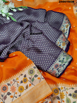An orange Banarasi silk saree with floral printed style and zari weaving work