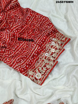 A white chinon silk Bollywood style saree with embellishments and gotapatti work