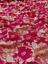 A Banarasi style saree with cutdana work, predominantly pink with gold geometric patterns