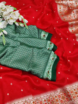 A red saree with white patternsBanarasi Zari Weaving Saree