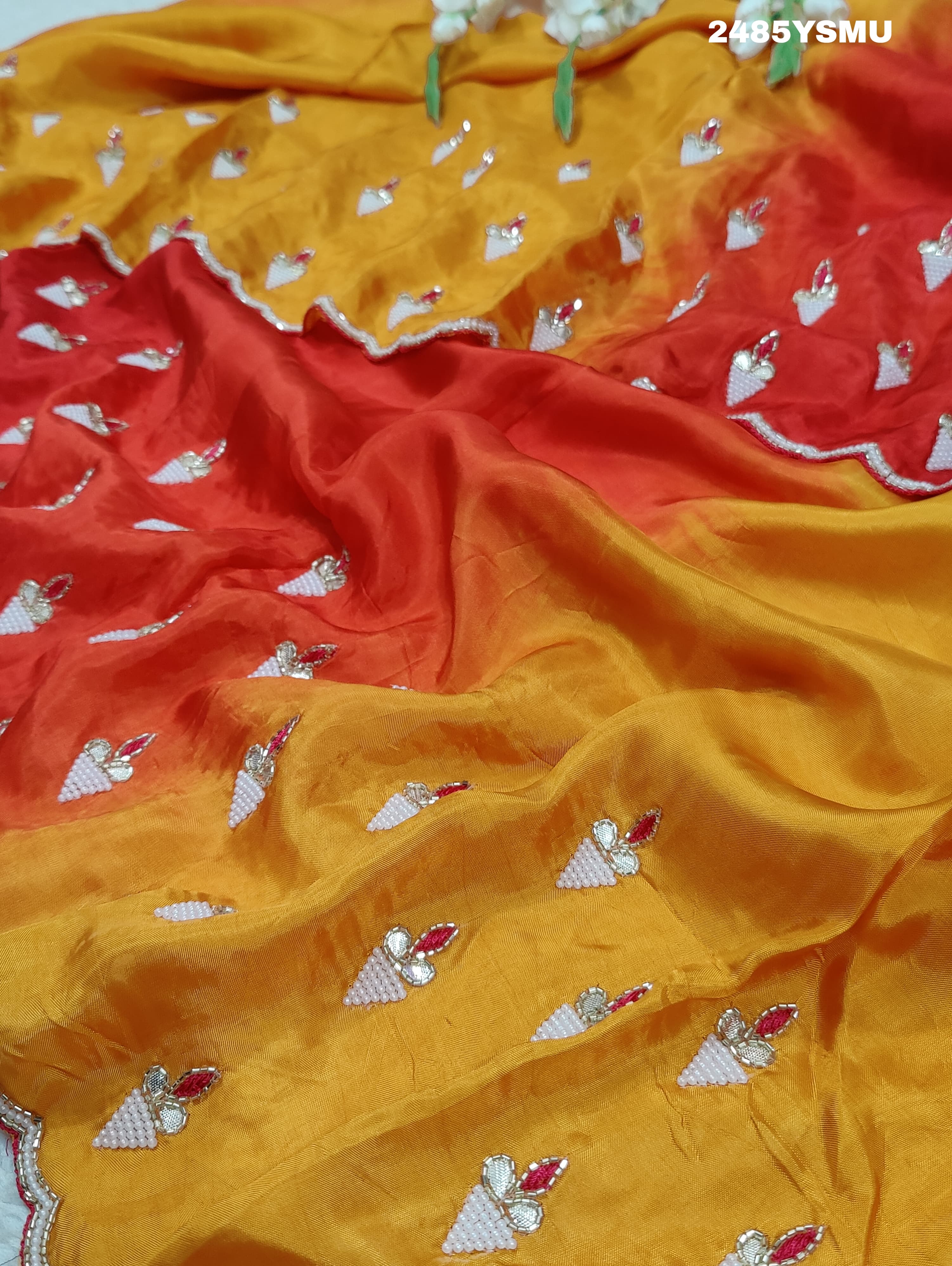 A Chinon silk saree with Gotapatti work, featuringof yellow and pink colors 
