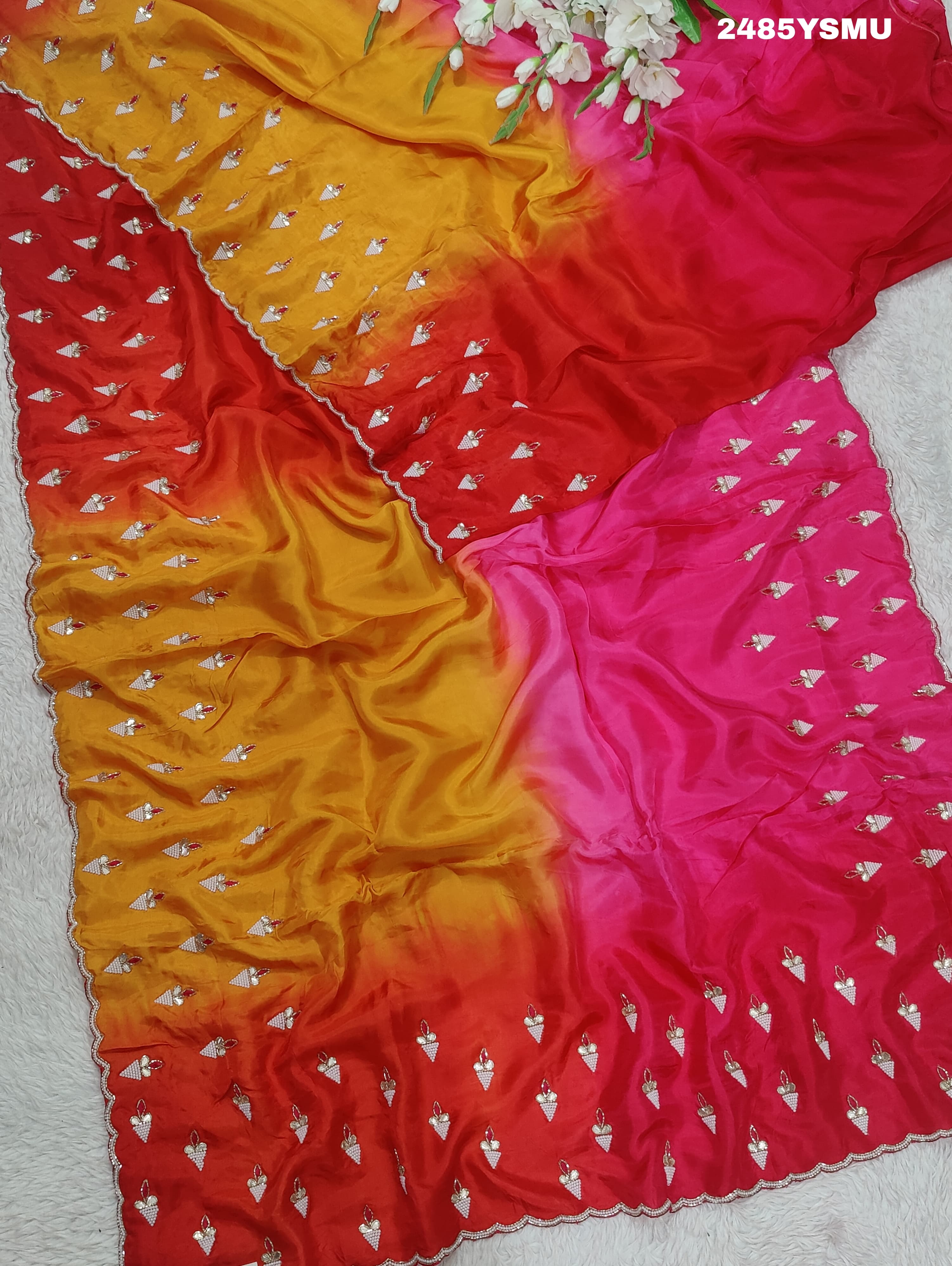 A Chinon silk saree with Gotapatti work, featuringof yellow and pink colors 
