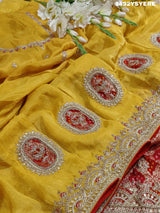 A Banarasi silk saree with sequence embroidery work, featuring a design in yellow and red patterns
