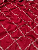 A maroon saree with geometric pattern and pittan work