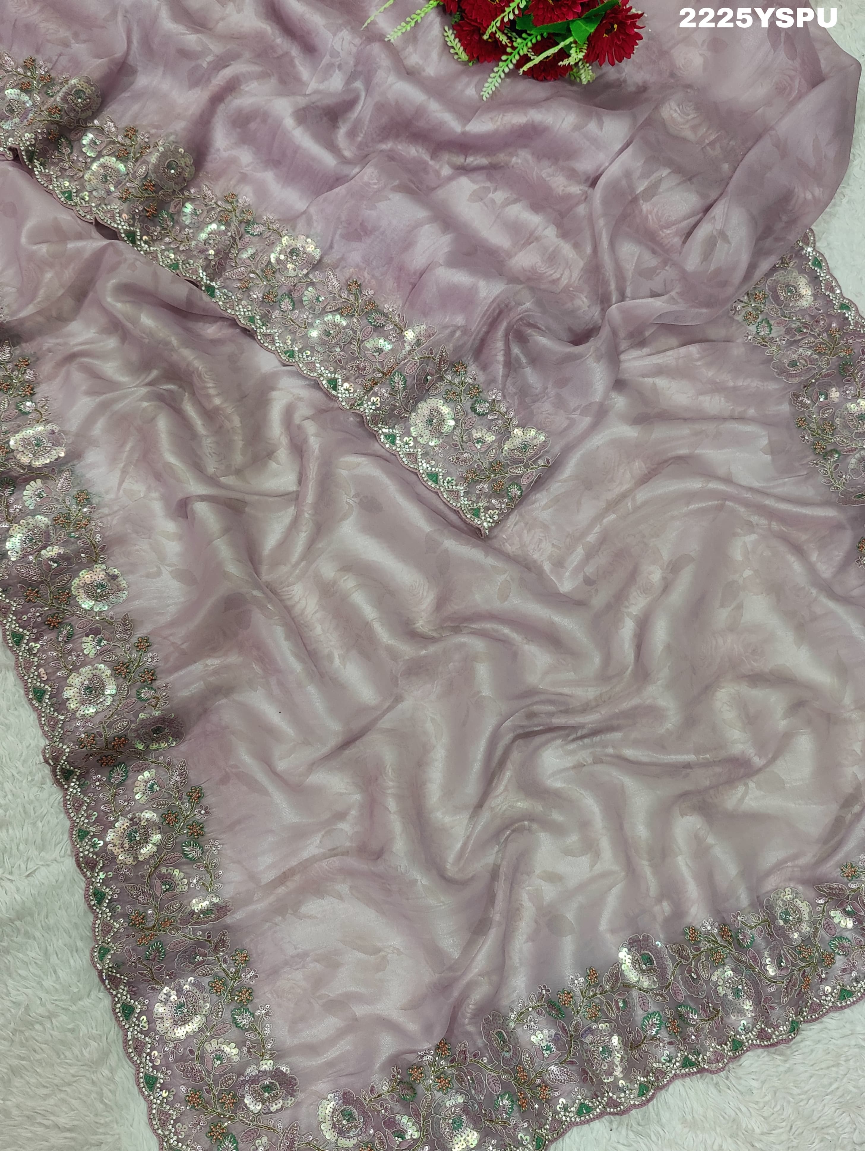 A purple tissue silk Bollywood style saree with sequence embroidery work 