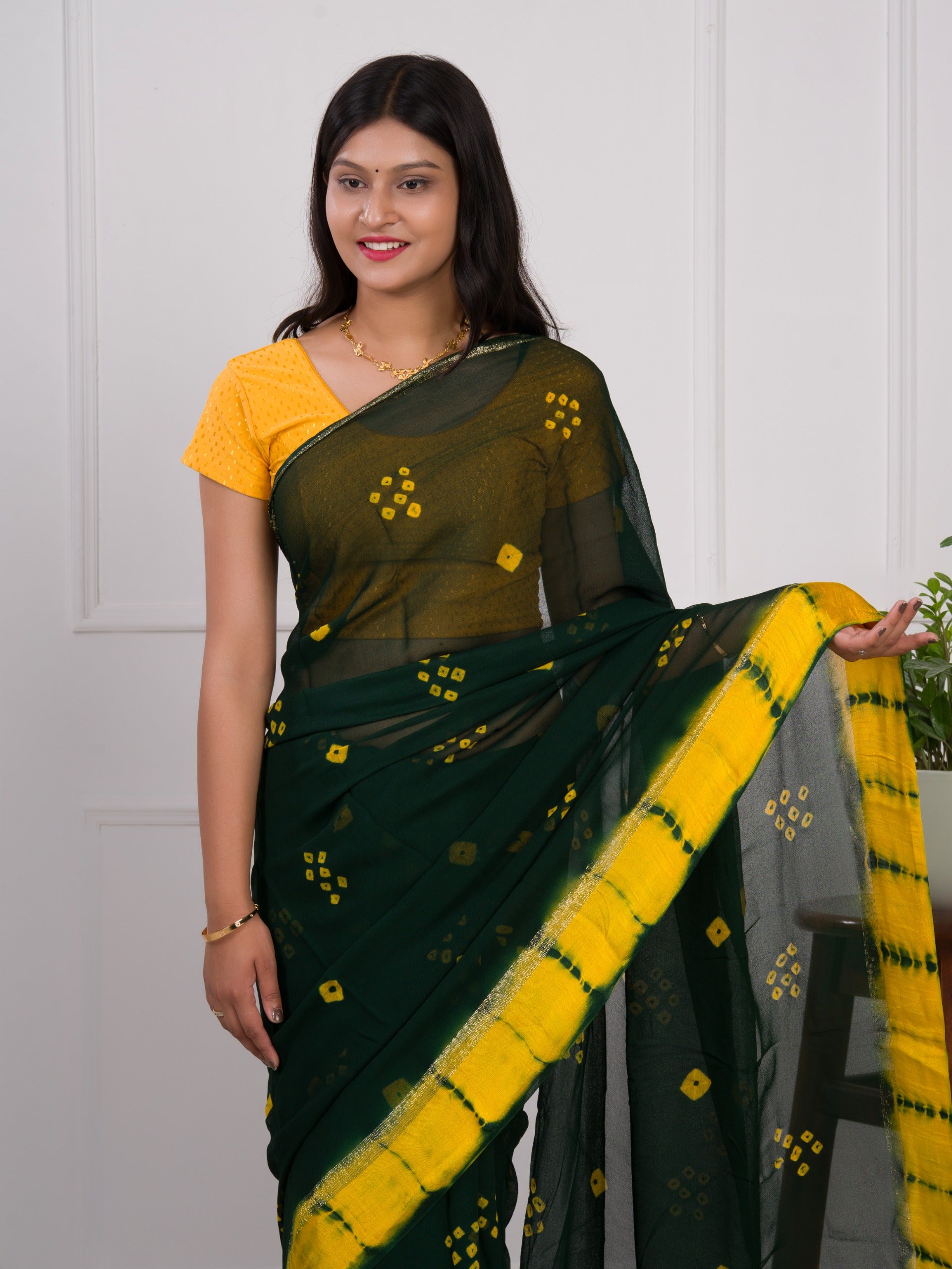 Georgette Gulti Bandhej Satin Patta Border Saree in green colour