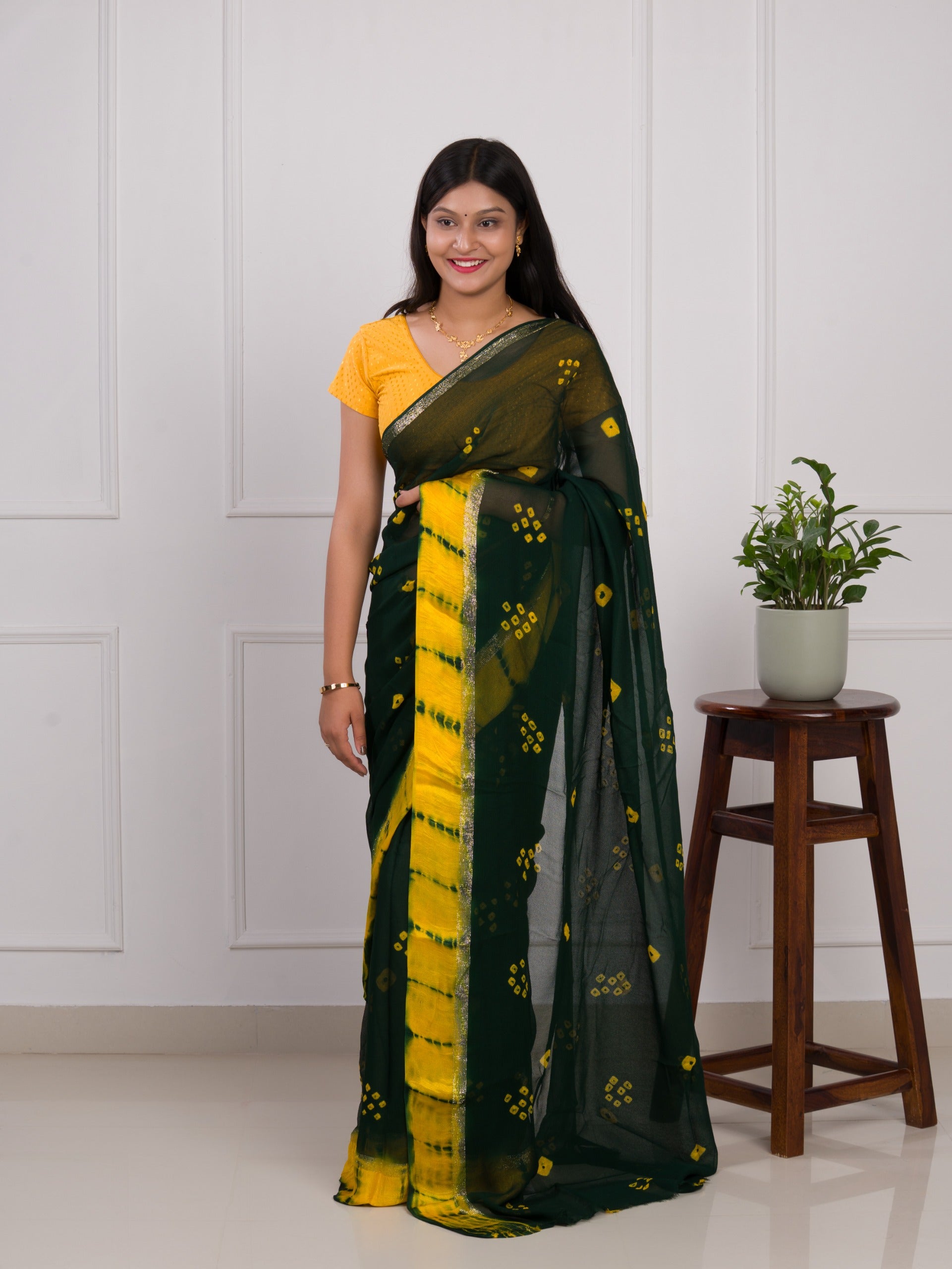 Georgette Gulti Bandhej Satin Patta Border Saree in green colour