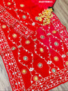 Red saree with white and gold floral patternsBollywood Style with Gotapatti Work