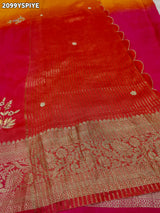 A orange and pink colour saree with floral zardozi work and Banarasi style 