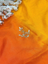 By Orange saree with gold border and floral embroidery