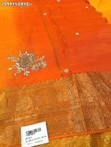 By Orange saree with gold border and floral embroidery