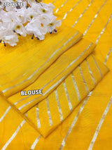 By Yellow saree with silver embroiderySilk Leheriya Style for festive 