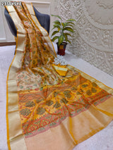 Yellow and beige saree with intricate patternsCotton Silk Printed With Zari border .