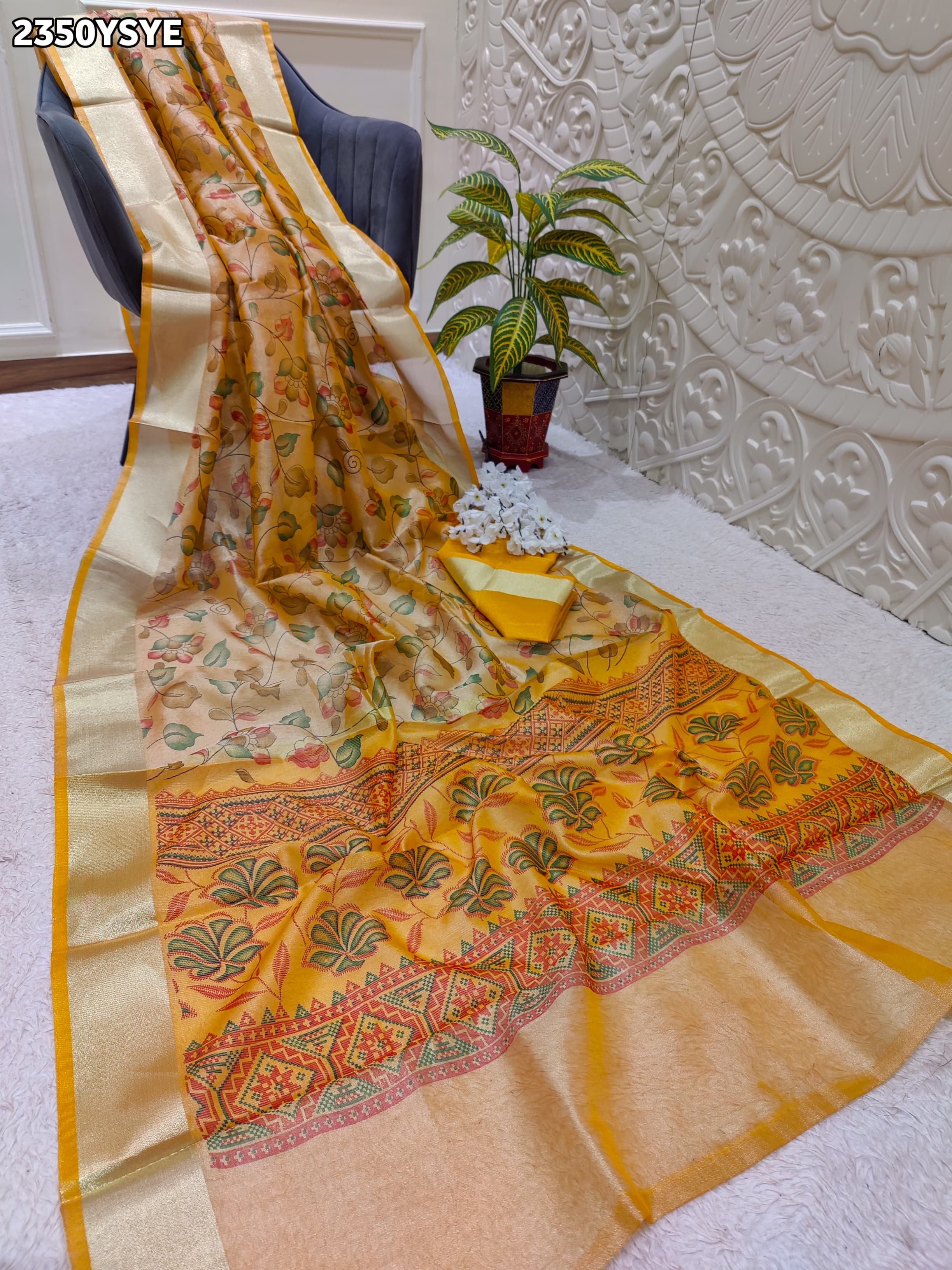 Yellow and beige saree with intricate patternsCotton Silk Printed With Zari border .