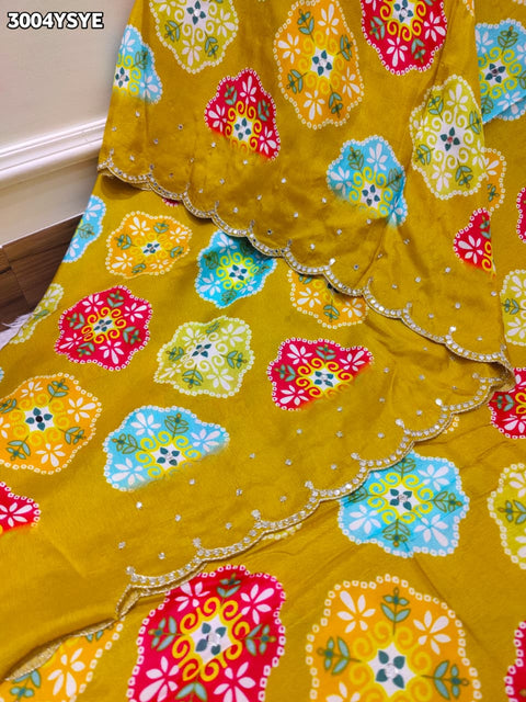 Yellow saree with colorful floral patterns and mirror work
