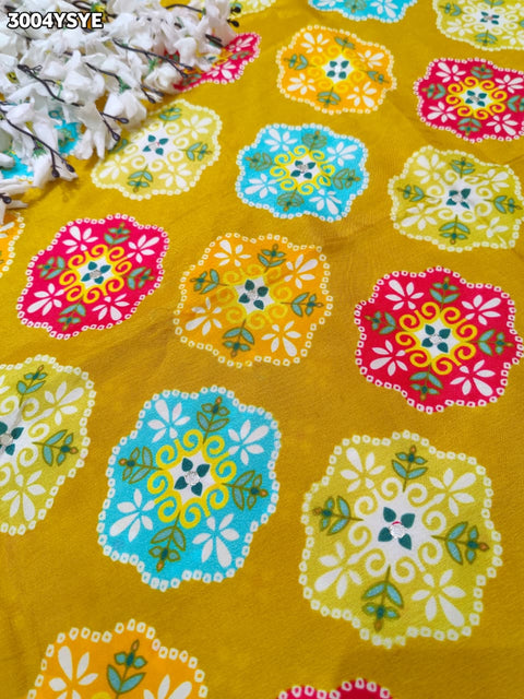 Yellow saree with colorful floral patterns and mirror work