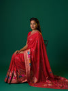 A red munga silk saree with zari border.