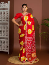 A red saree with bandhej style and gotapatti work in red and yellow colour