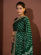  A green saree with bandhej and gotapatti work.