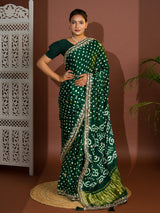 A green saree with bandhej and gotapatti work.