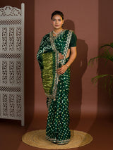  A green saree with bandhej and gotapatti work.