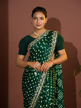  A green saree with bandhej and gotapatti work.