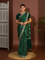  A green saree with bandhej and gotapatti work.