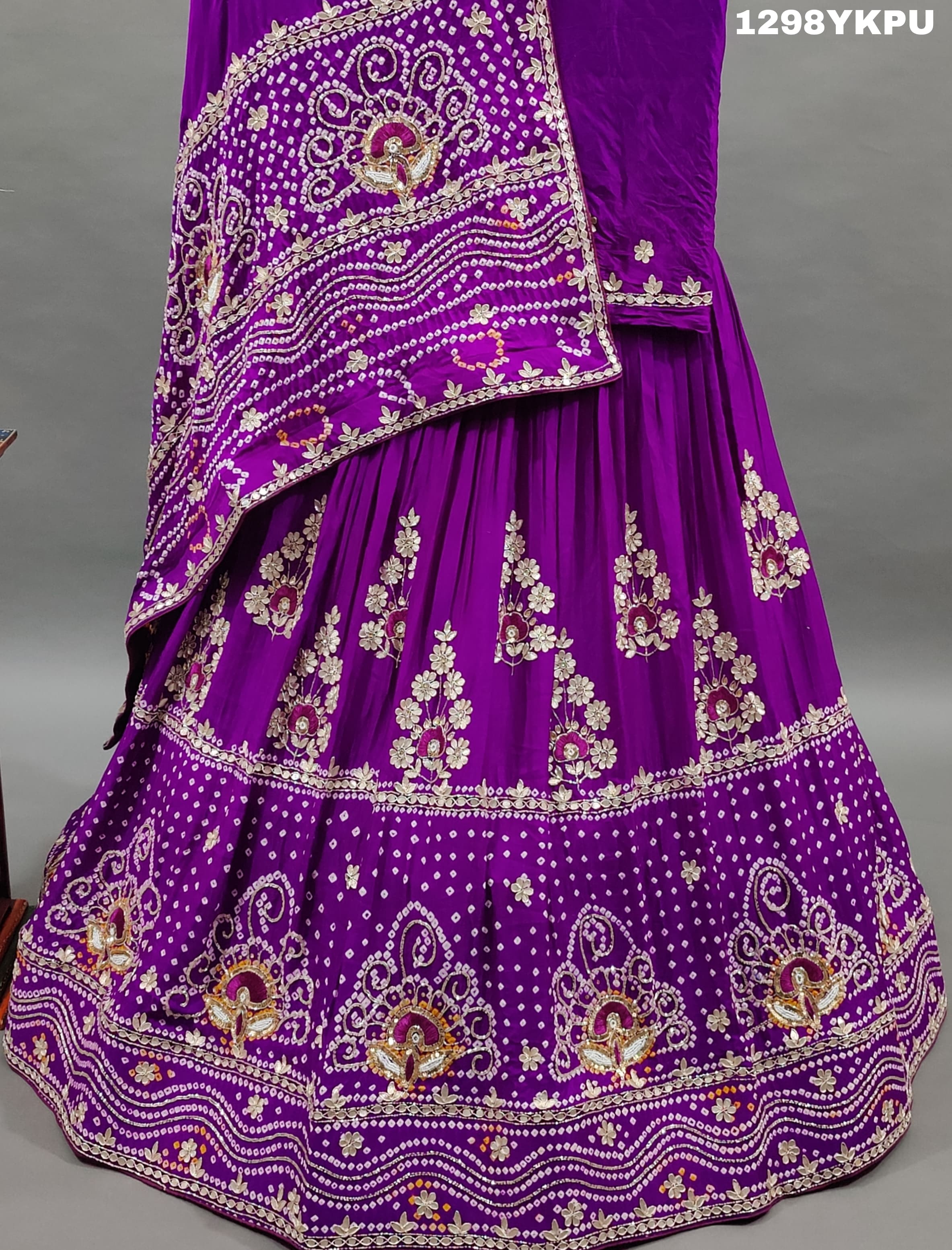 A purple Gajji silk lehenga with white bead work