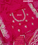 A pink and red bandhani style saree with gotapatti work