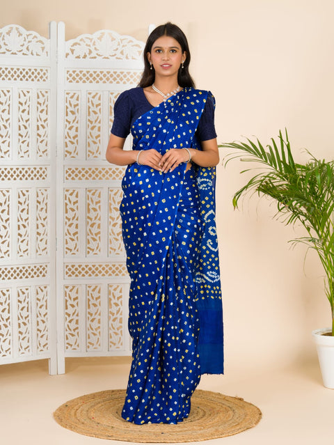 A blue saree with bandhani print and lagdi patola pallu 
