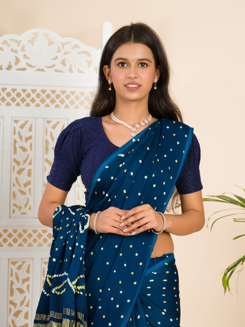 A blue saree with bandhani print and a lagdi patla pallu, 