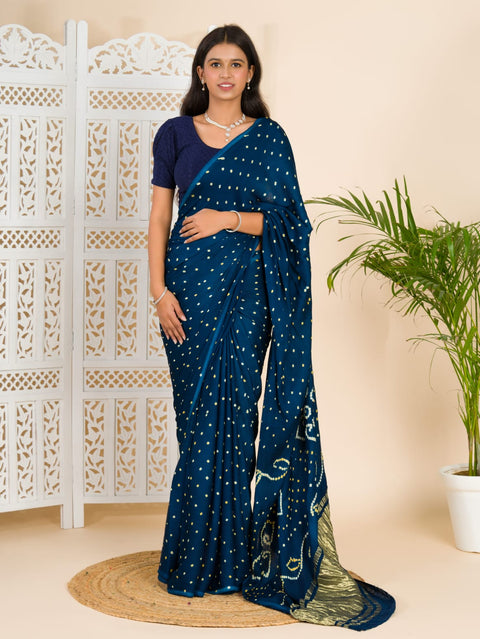 A blue saree with bandhani print and a lagdi patla pallu, 