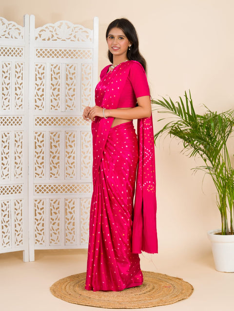 A pink saree with a bandhani pattern and a lagdi pallu design, 