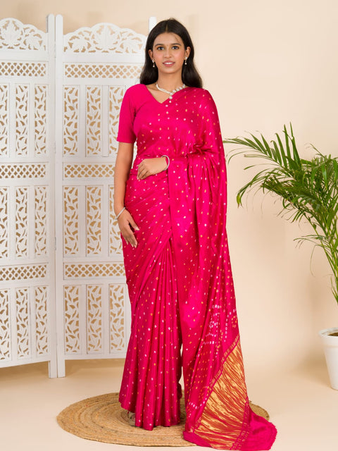 A pink saree with a bandhani pattern and a lagdi pallu design, 