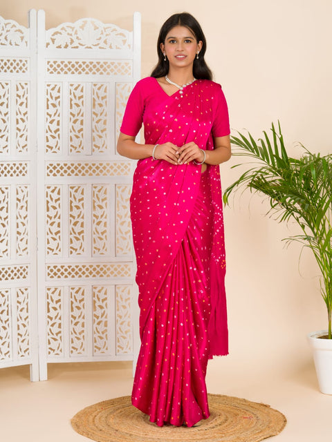 A pink saree with a bandhani pattern and a lagdi pallu design, 