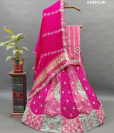 A traditional pink Lehenga with Bandhani style