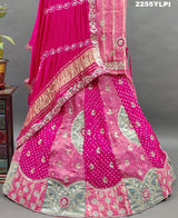 A traditional pink Lehenga with Bandhani style