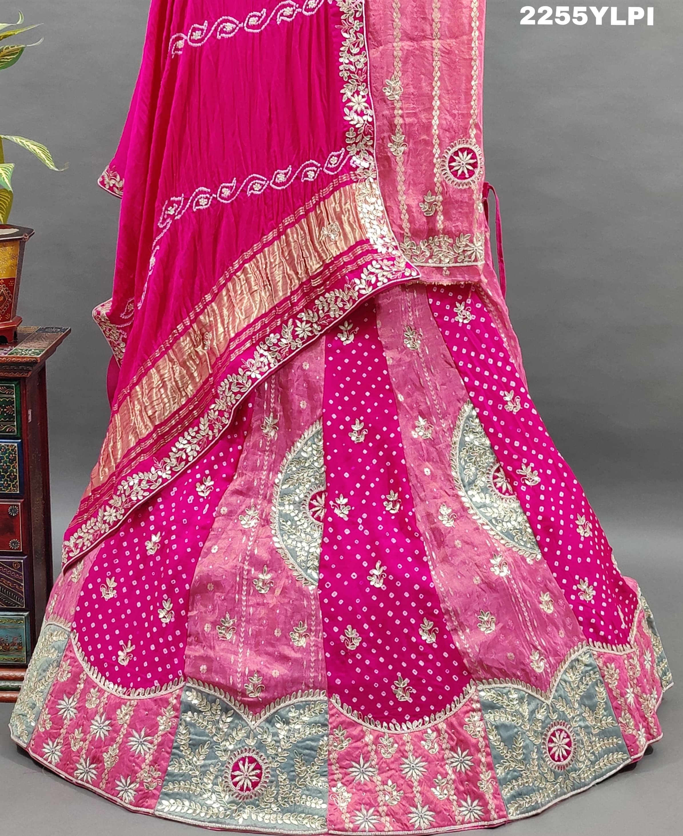 A traditional pink Lehenga with Bandhani style