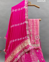 A traditional pink Lehenga with Bandhani style