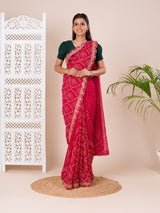 Ared and pink bandhani style saree with gotapatti embellishments and a mangal patha design